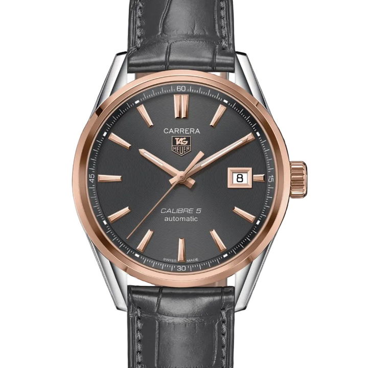 Carrera watch with black dial and rose gold accents on a white background